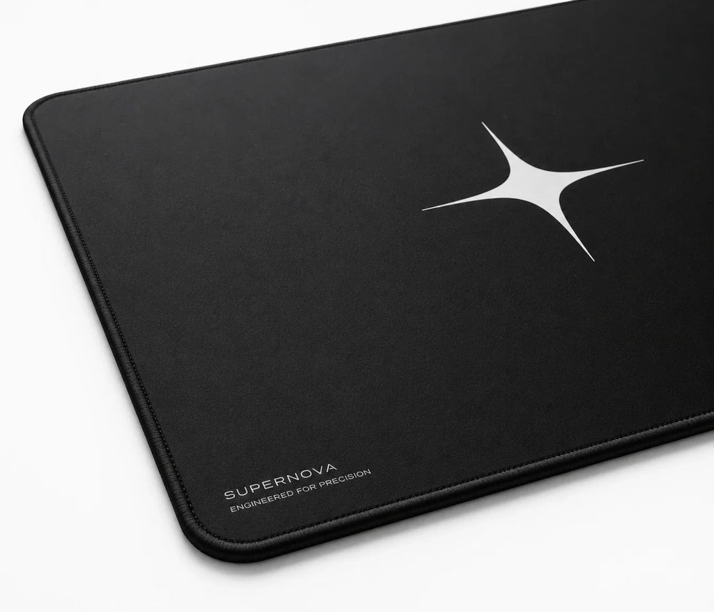Black gaming mousepad with white star logo, precision-engineered for gamers, minimalist design